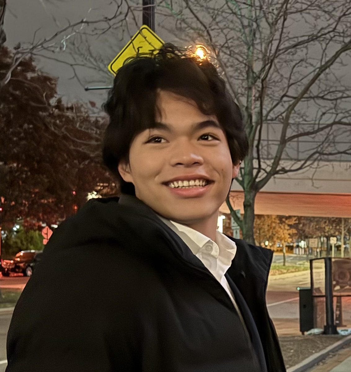 Dom Pann smiling outdoors